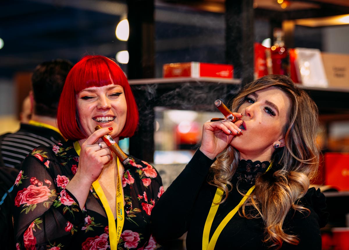 Women with cigars at Total Product Expo
